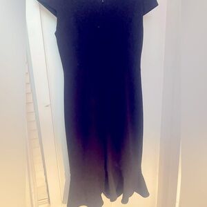 Betsy Johnson black dress with ruffle on the bottom. Worn once .